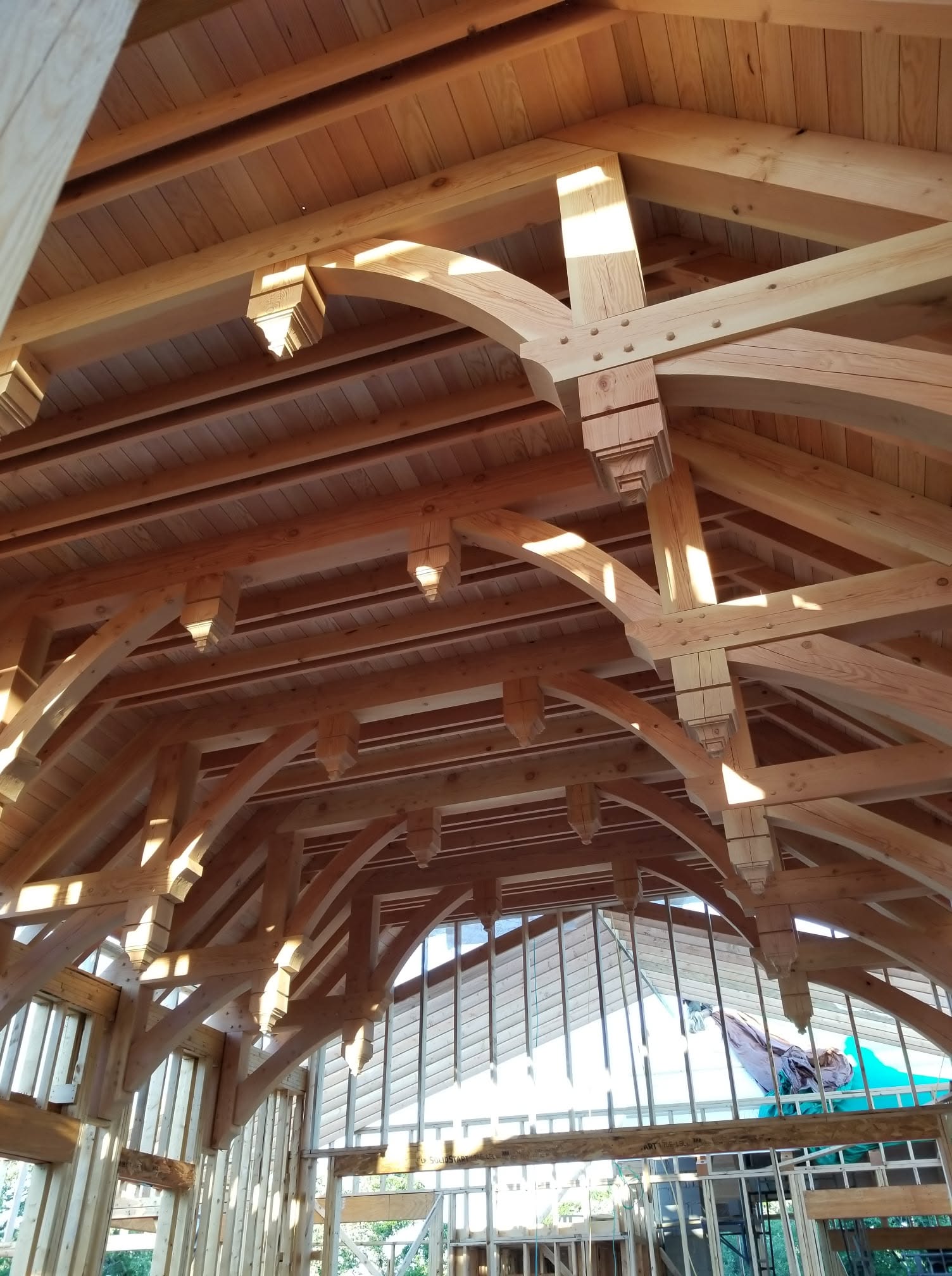 Detailed timber framing with arched braces and exposed rafters